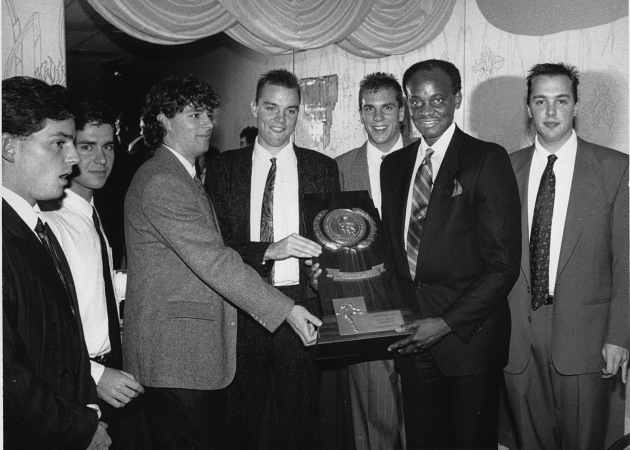 Glassboro State players present trophy to college president